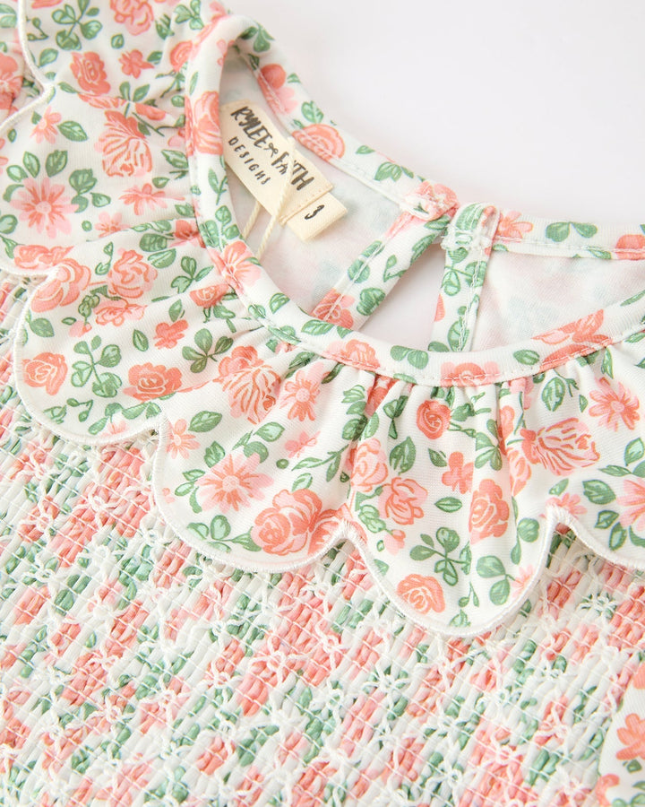 Floral girls dress with petal collar and smocked bodice detail, peach and green