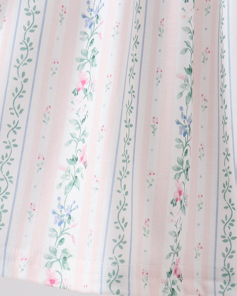 Floral striped fabric with pink, green, and blue patterns on a white background