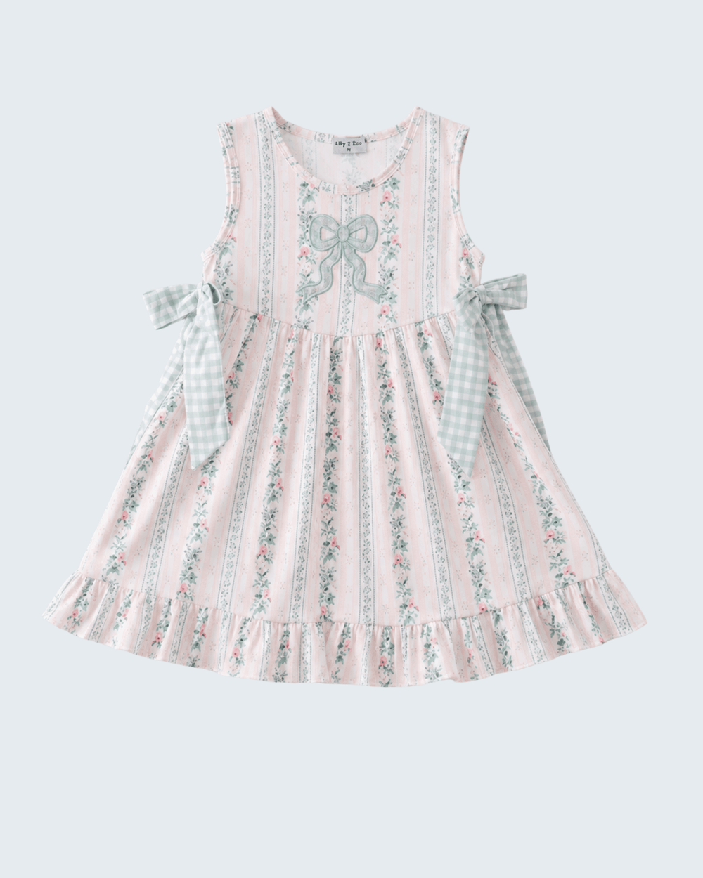 Pink floral dress with bow details on a light gray background