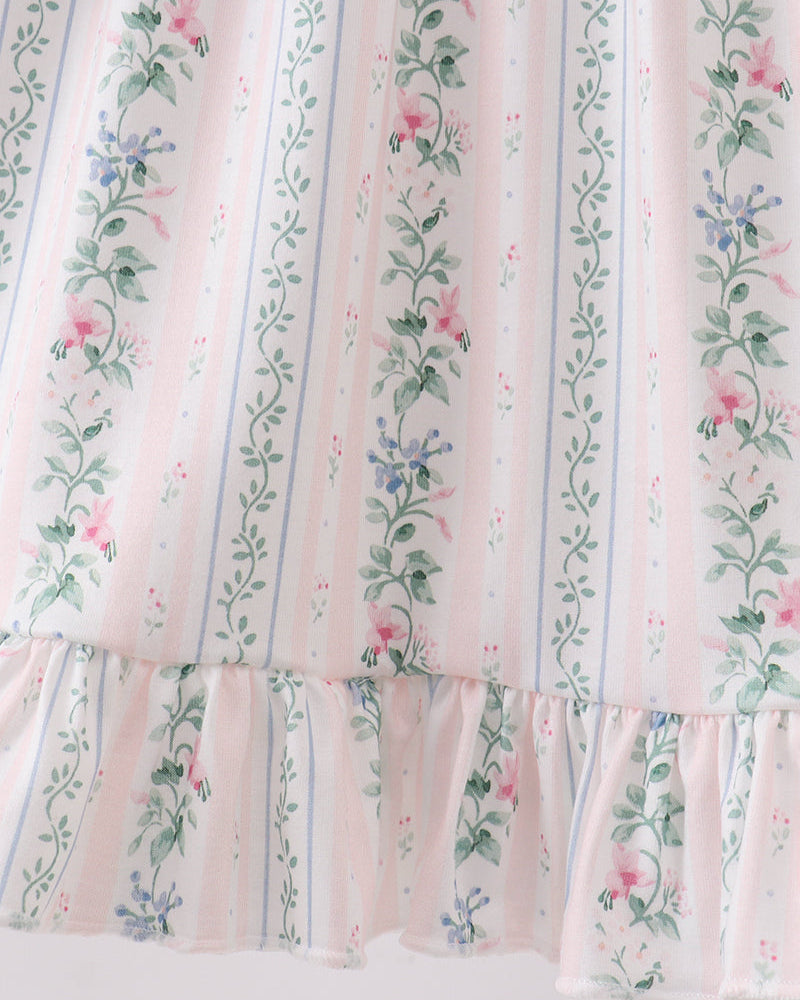 Floral striped fabric with a ruffled edge on a white background