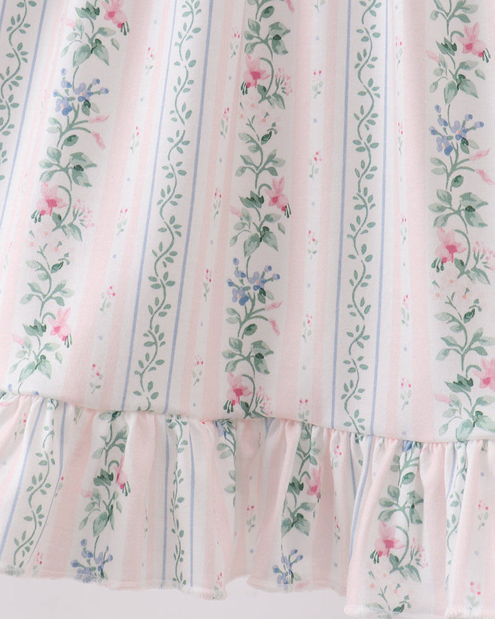 Floral striped fabric with a ruffled edge on a white background
