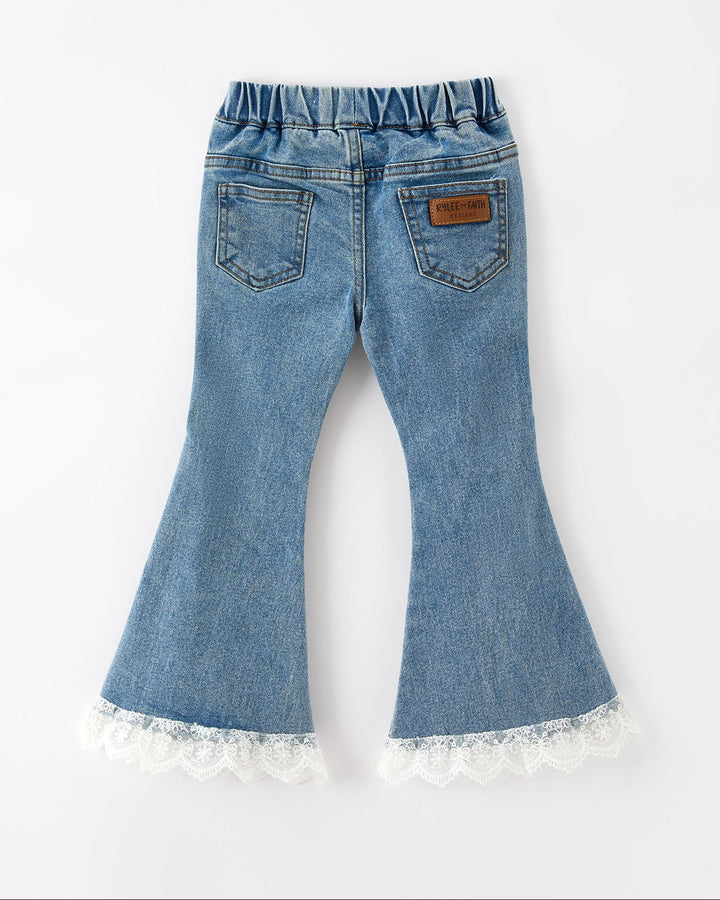 Girls blue flare jeans, back view, two pockets and white lace-trim bell hem
