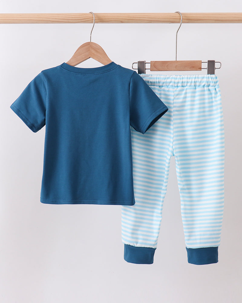 Boys embroidered apple boutique outfit on wooden hanger