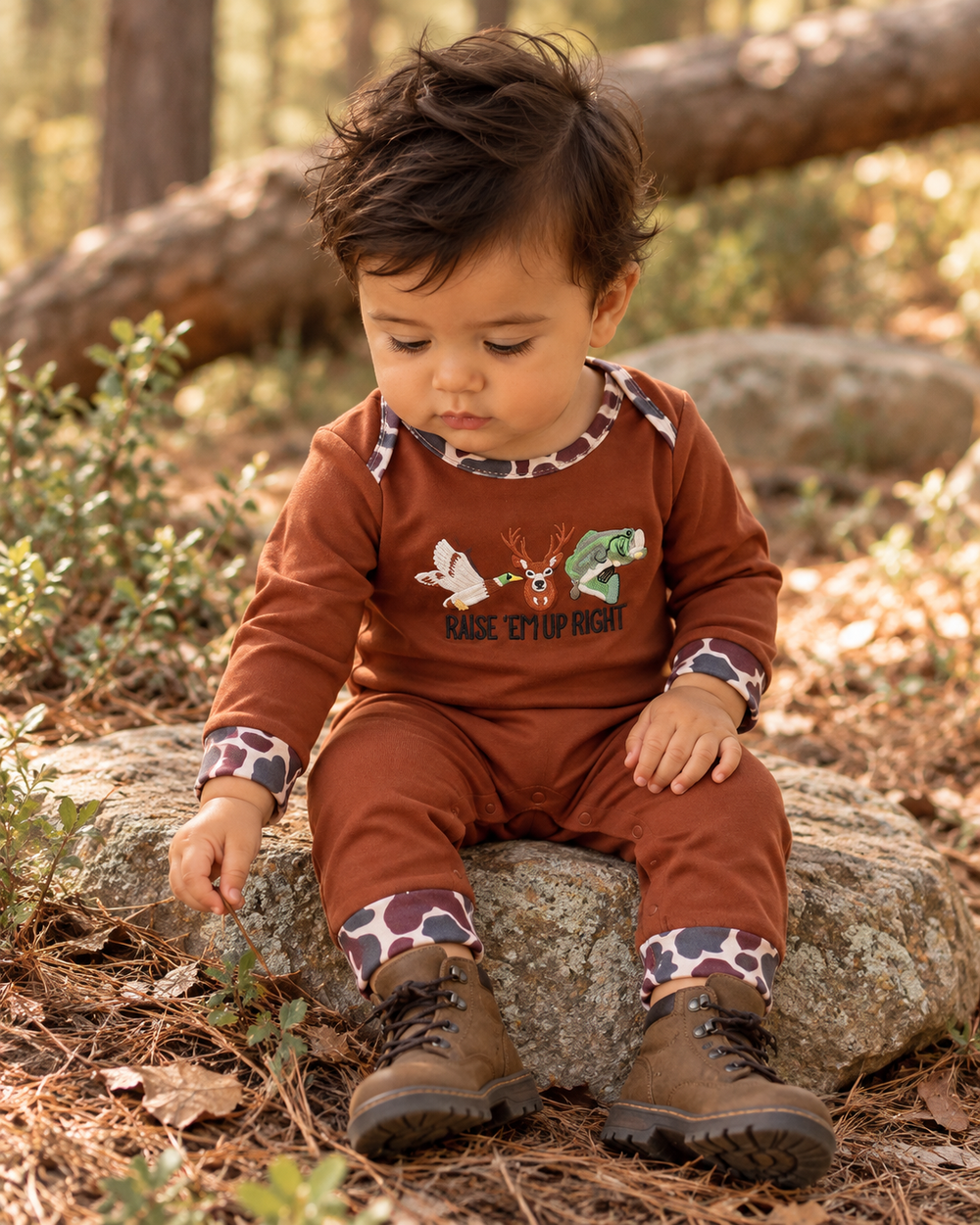Baby boy is wearing a Brown Camouflage Hunting Embroidered Baby Boy Romper