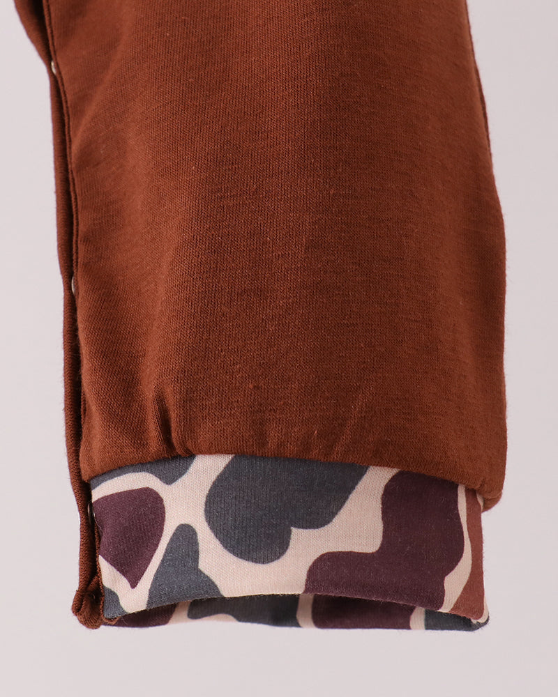 Brown romper with camouflage print hem trim along cuffs and legs