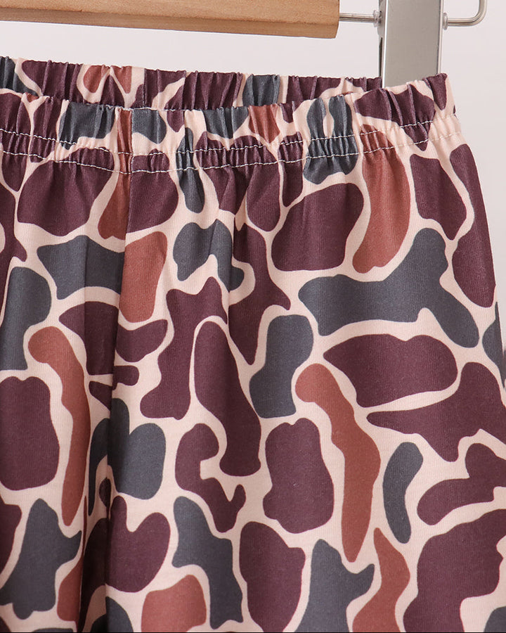 Camouflage pants with elastic waistband, adjustable drawstring, and matching pattern.