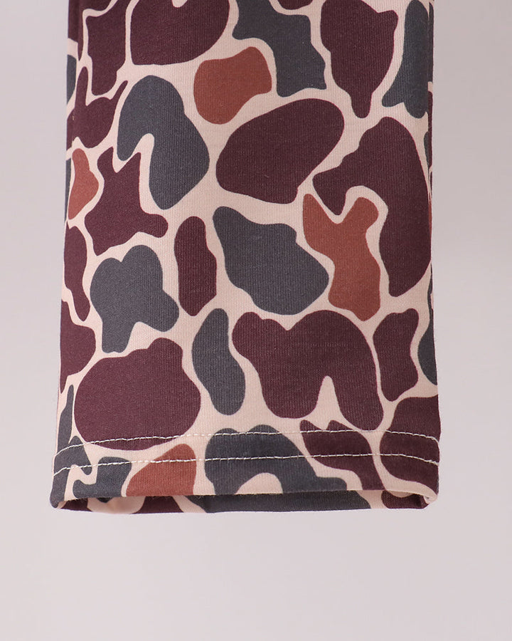 Camouflage pants hem with stitched cuff and all-over camo pattern.