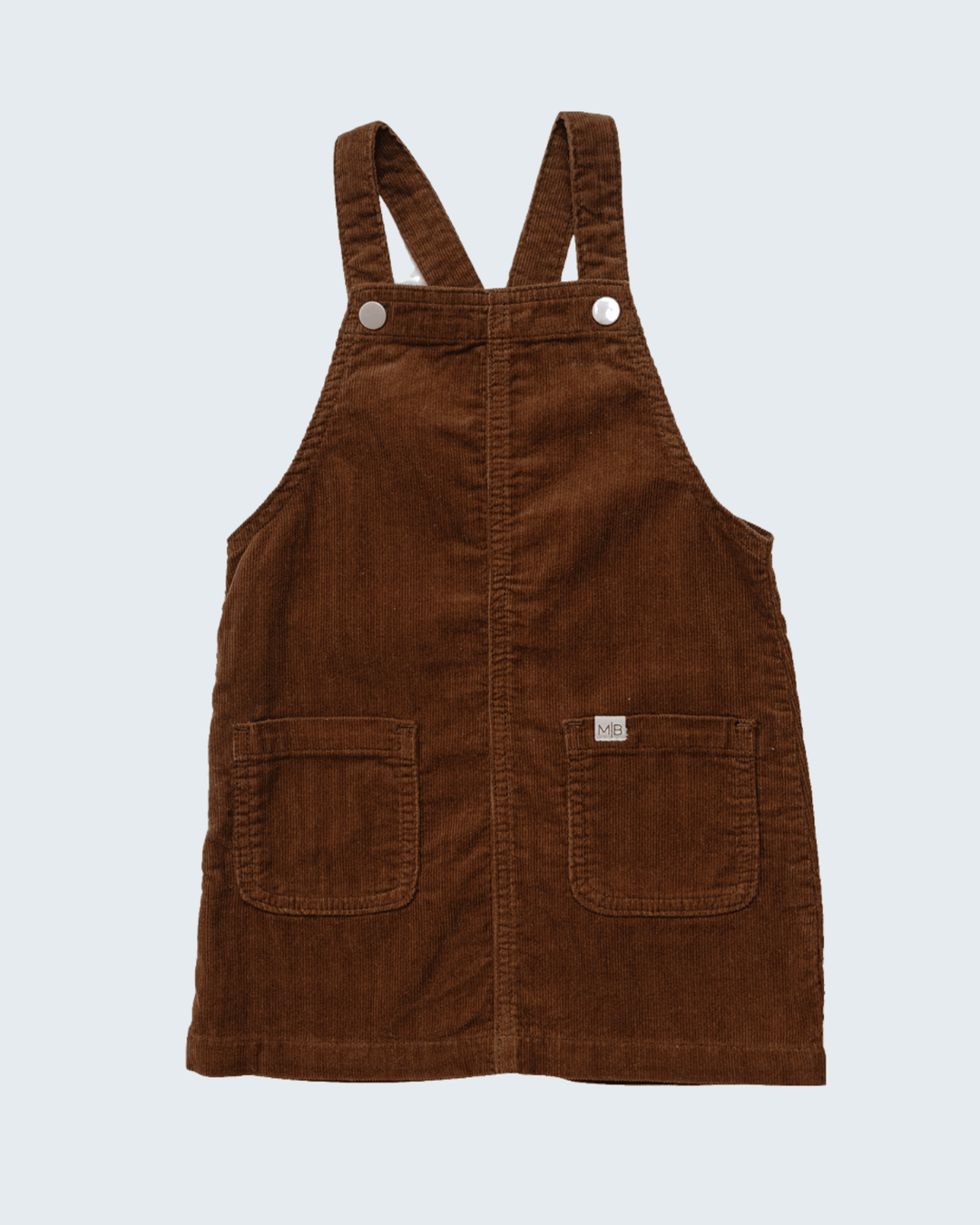 Brown corduroy overall dress with two front snap buttons and chest pockets