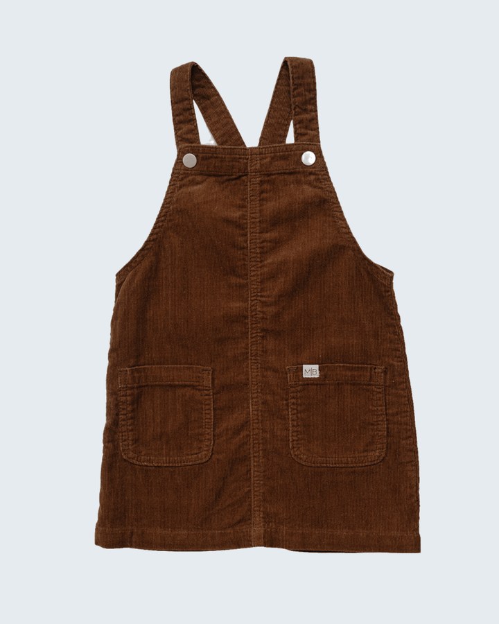 Brown corduroy overall dress with two front snap buttons and chest pockets