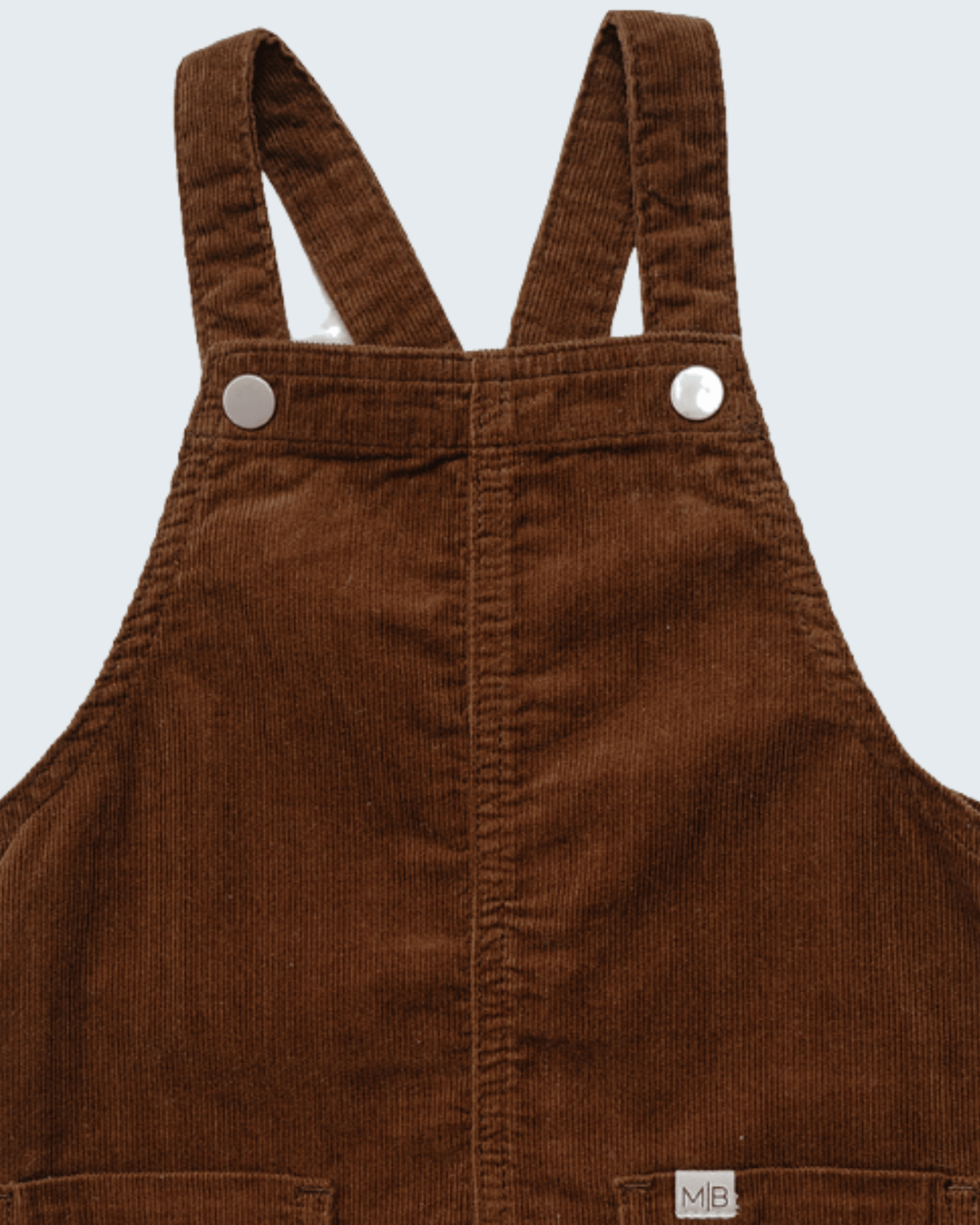 Brown corduroy overall dress with buttoned bib and two front pockets