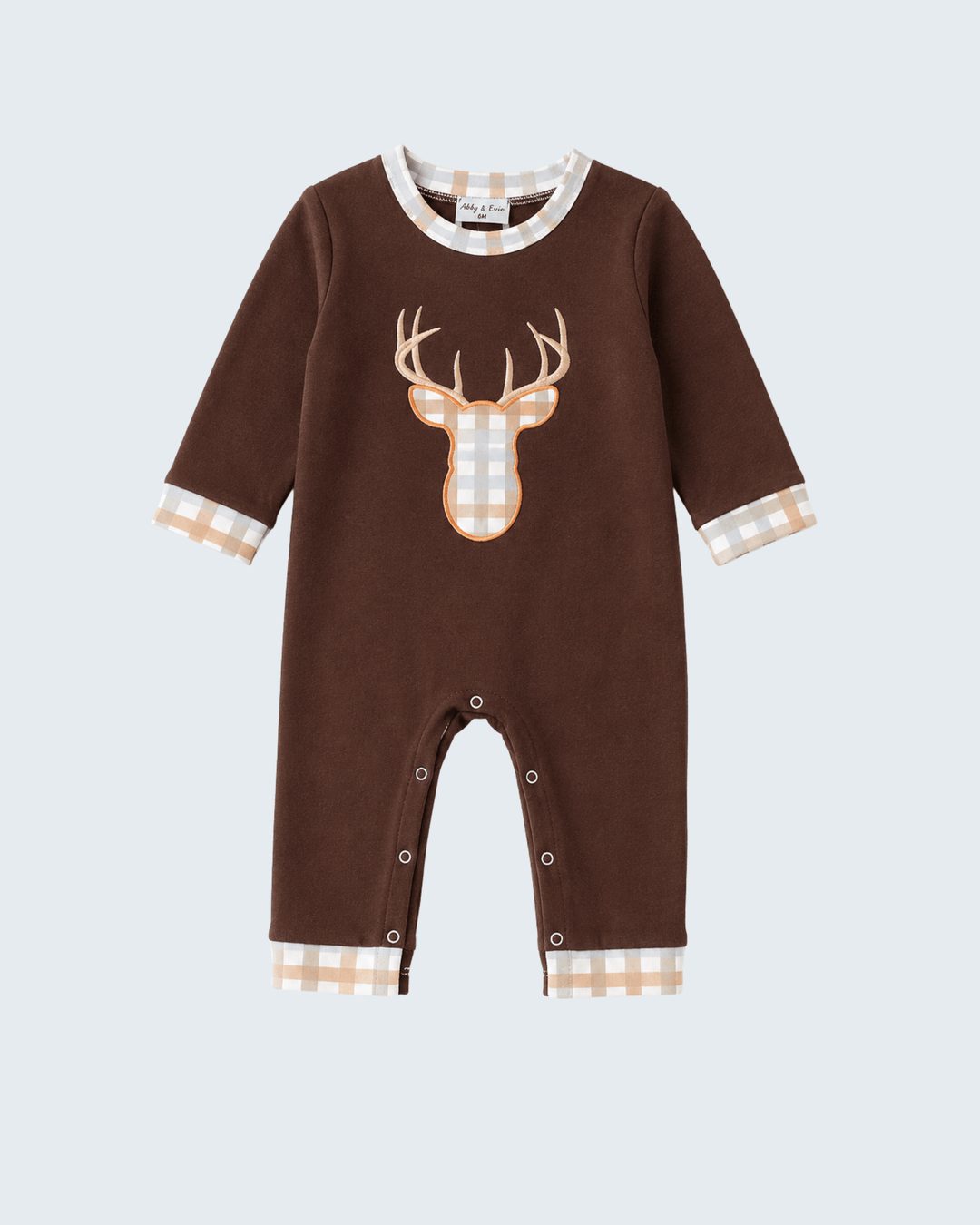A baby long-sleeve romper in dark brown, featuring a large deer head graphic on the chest and beige-and-white gingham trim on the collar, cuffs, and leg hems.