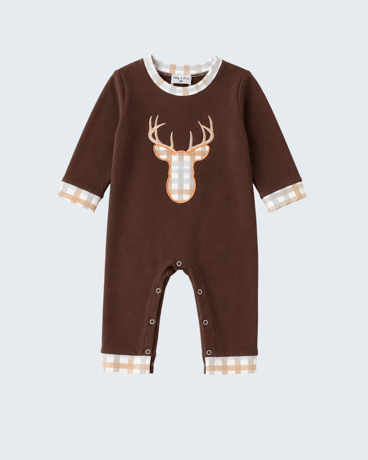 A baby long-sleeve romper in dark brown, featuring a large deer head graphic on the chest and beige-and-white gingham trim on the collar, cuffs, and leg hems.