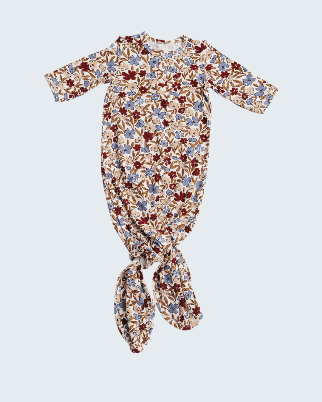 Floral patterned baby gown on a light gray background