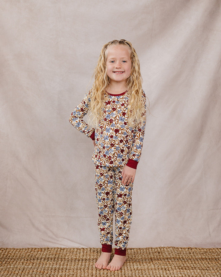 Kids floral long-sleeve pajama set with burgundy cuffs and matching pants