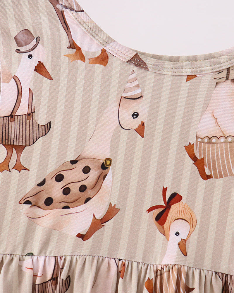 Cream animal-print long-sleeve tunic with gathered hem and brown goose graphics