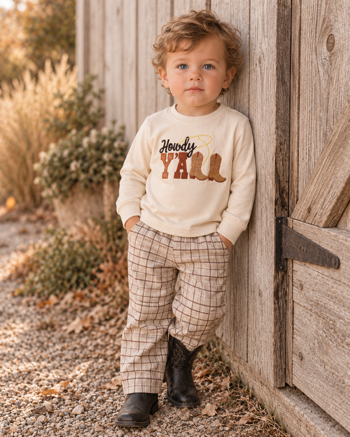 Young child wearing cream Howdy Y&