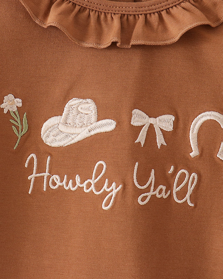 Brown long-sleeve top with ruffled neckline and “Howdy Y’all” embroidery