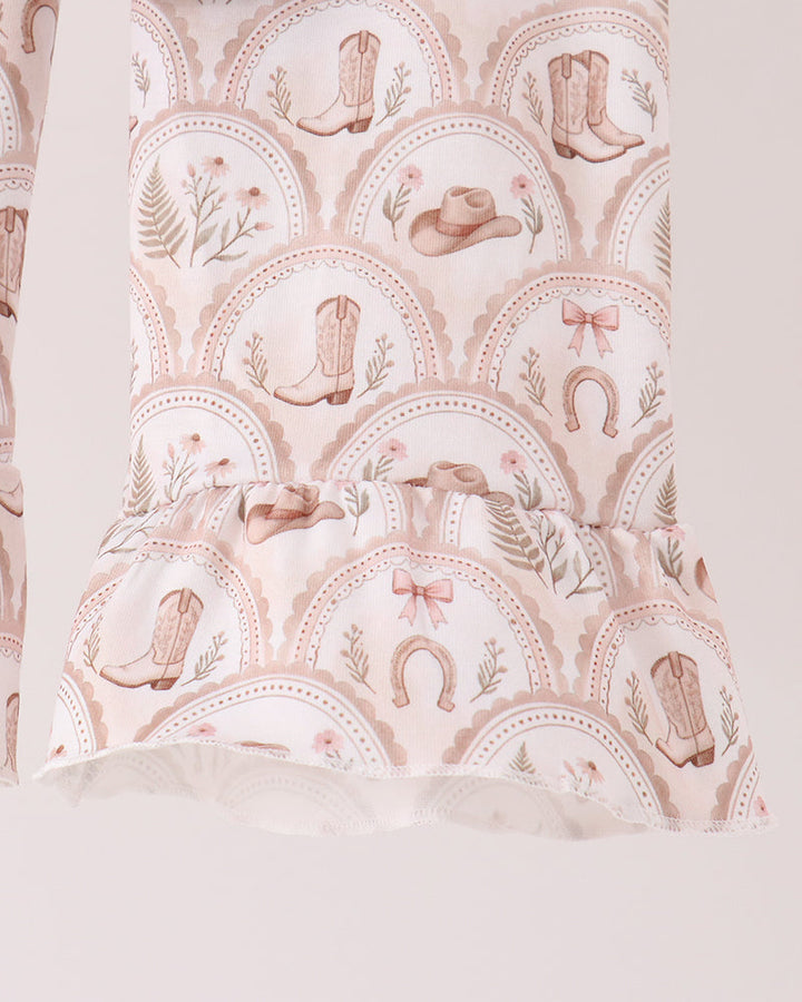 Cream patterned ruffle pants with western boots, hats, and rainbows
