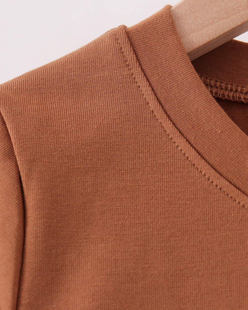 Brown crew neck with close-knit fabric and stitched seam