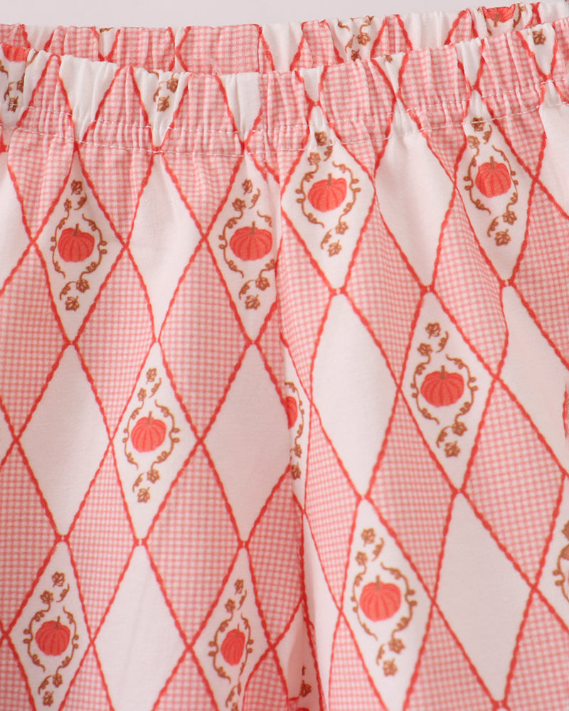 Red diamond print shorts fabric with pumpkin motif and smocked waist