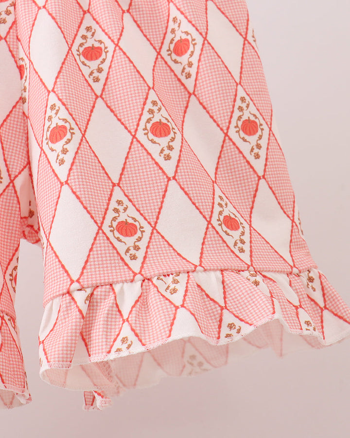 Red and white diamond pumpkin print shorts with layered ruffle hem