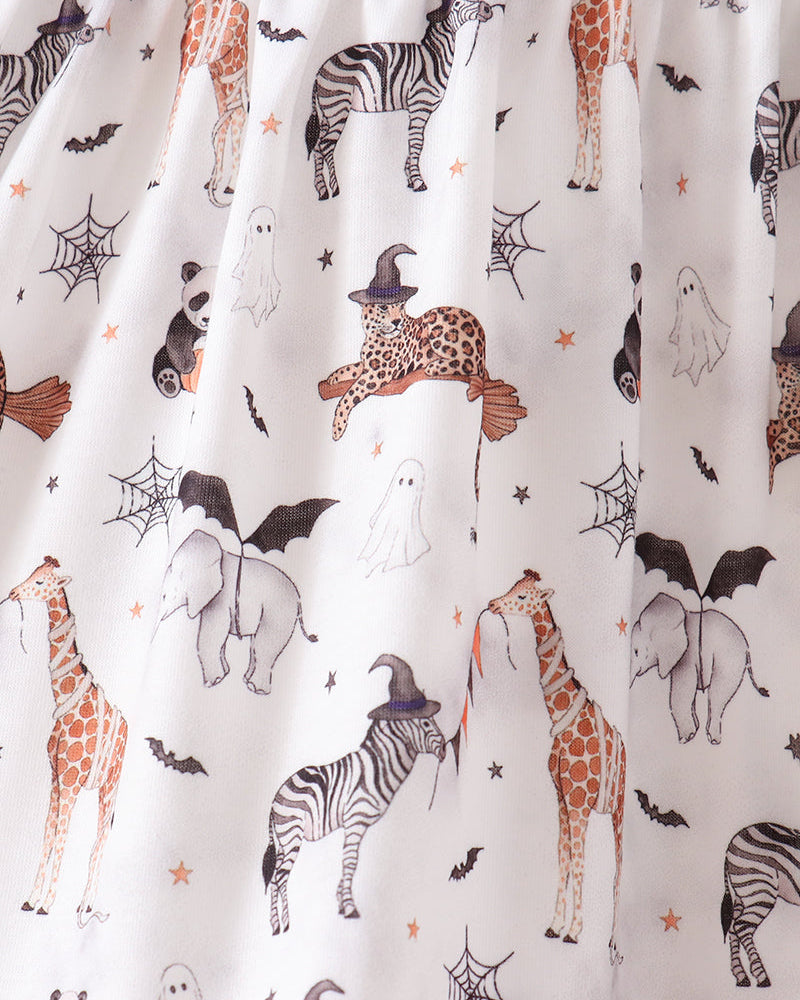 White fabric with a playful Halloween animal print featuring zebras, giraffes, pandas, bats, ghosts, spiders, and a witch cat wearing a hat.