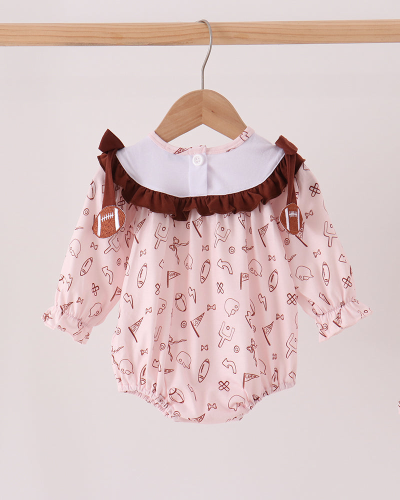 Toddler bubble romper with brown ruffle shoulders and full sports icon print
