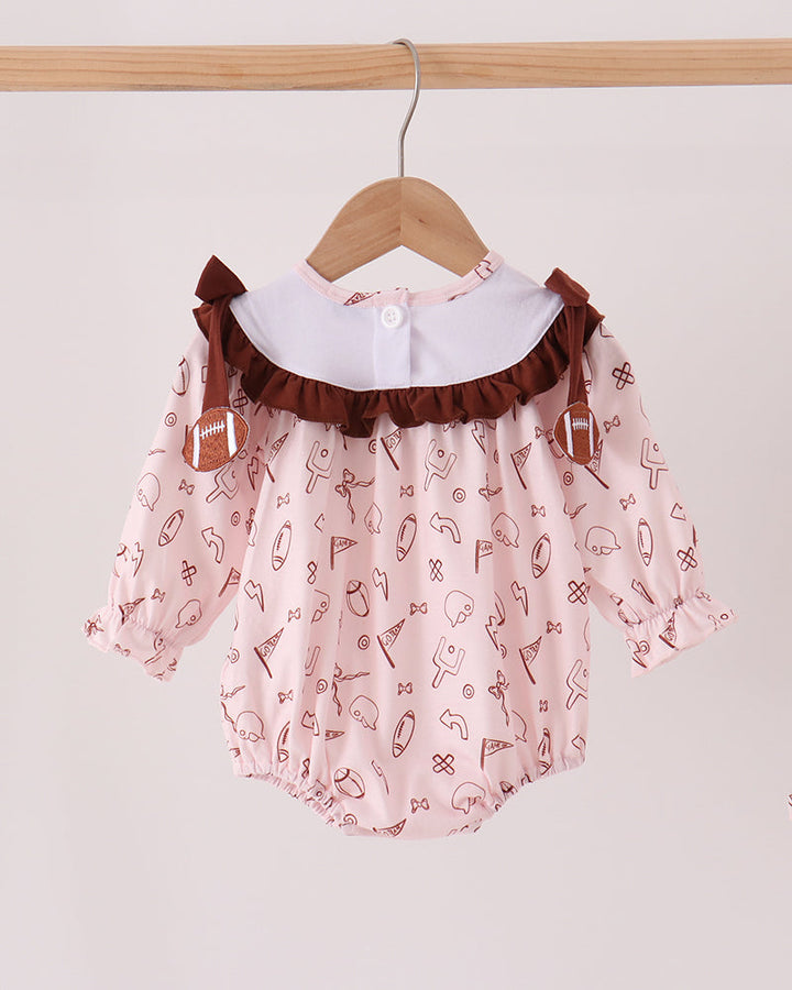 Toddler bubble romper with brown ruffle shoulders and full sports icon print
