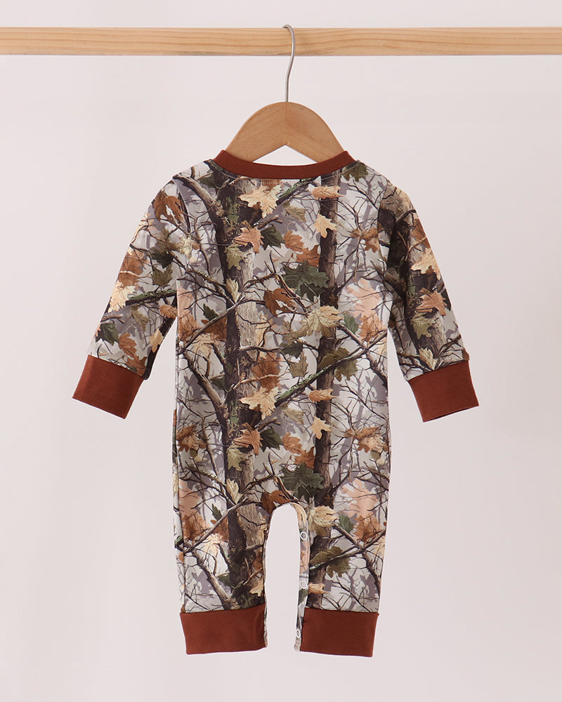 Camouflage tree-print footed romper with long sleeves and brown cuffs