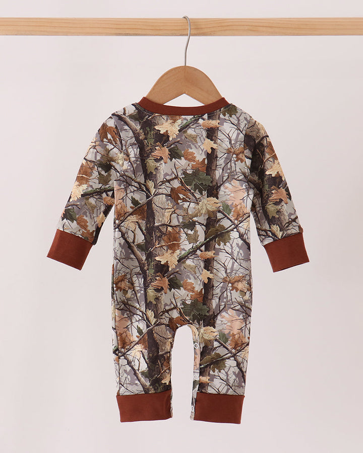 Camouflage tree-print footed romper with long sleeves and brown cuffs