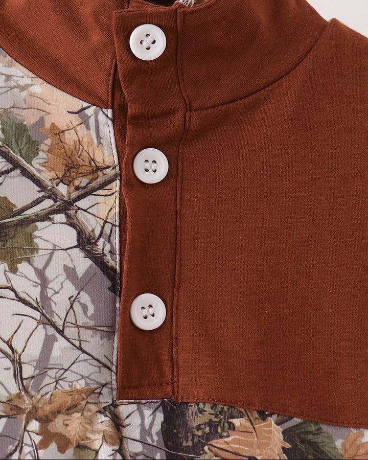 Tree-camouflage pullover close-up: brown stand collar and three white button snaps