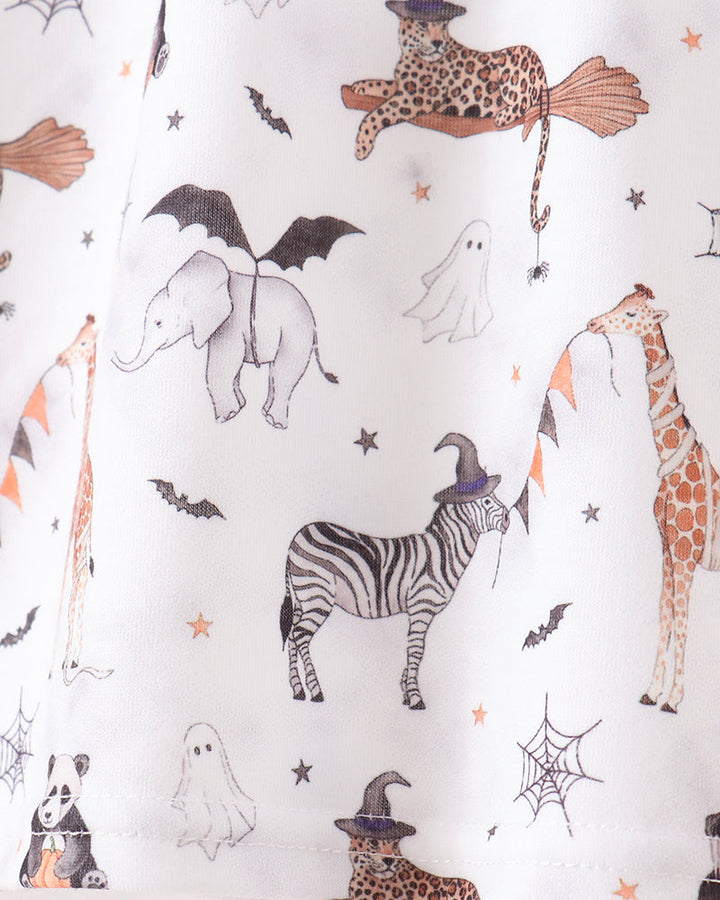 White fabric with a Halloween-themed animal print featuring a zebra, giraffe, elephant, leopard, spiderwebs, ghosts, bats, and stars in muted orange, brown, and black.