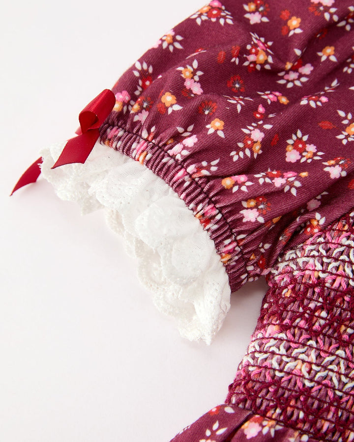 Burgundy floral dress sleeve with lace cuff and ruched smocked waist detail