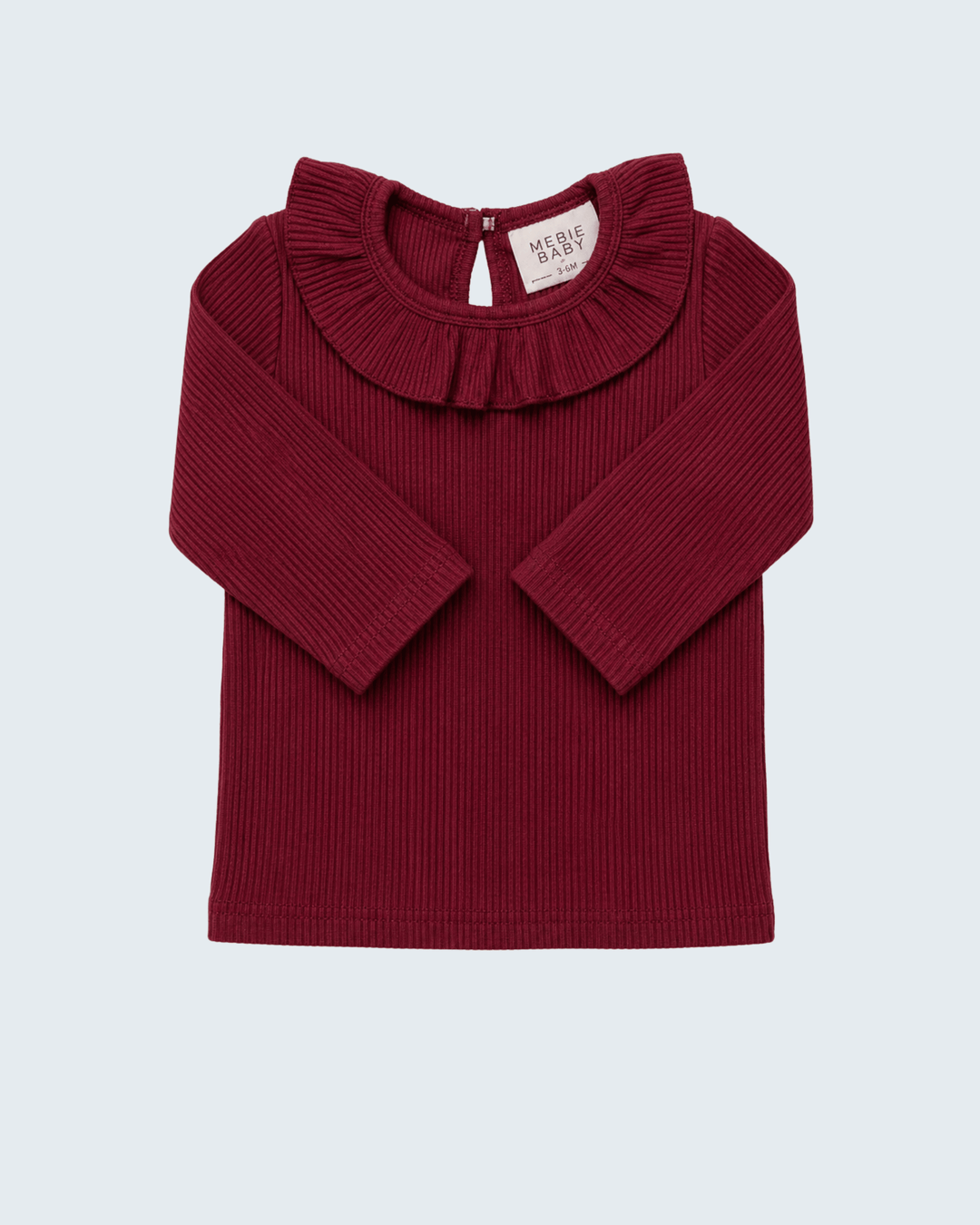 Burgundy ribbed knit long-sleeve top with ruffle collar and snap-button back