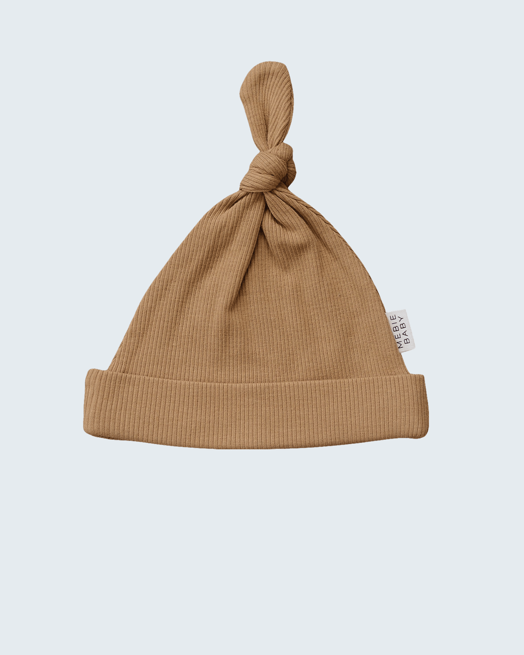 Brown baby hat with a knot on top against a light gray background