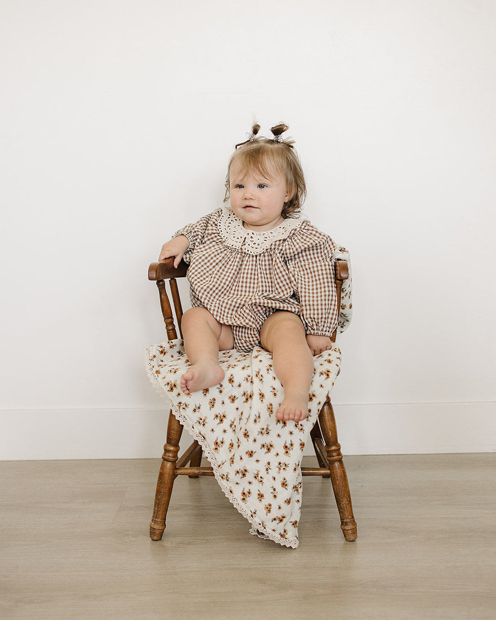 Camel gingham bubble romper with lace yoke and gathered long sleeves