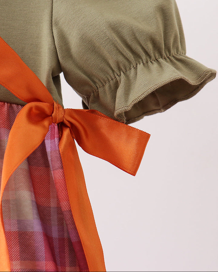 Olive bubble romper with orange bow tie and ruffled sleeve hem