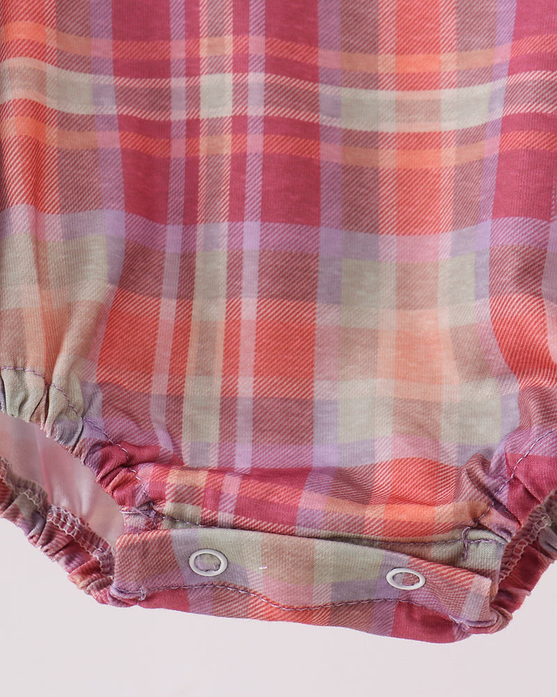 Plaid romper bottom with ruffled leg hem and snap buttons