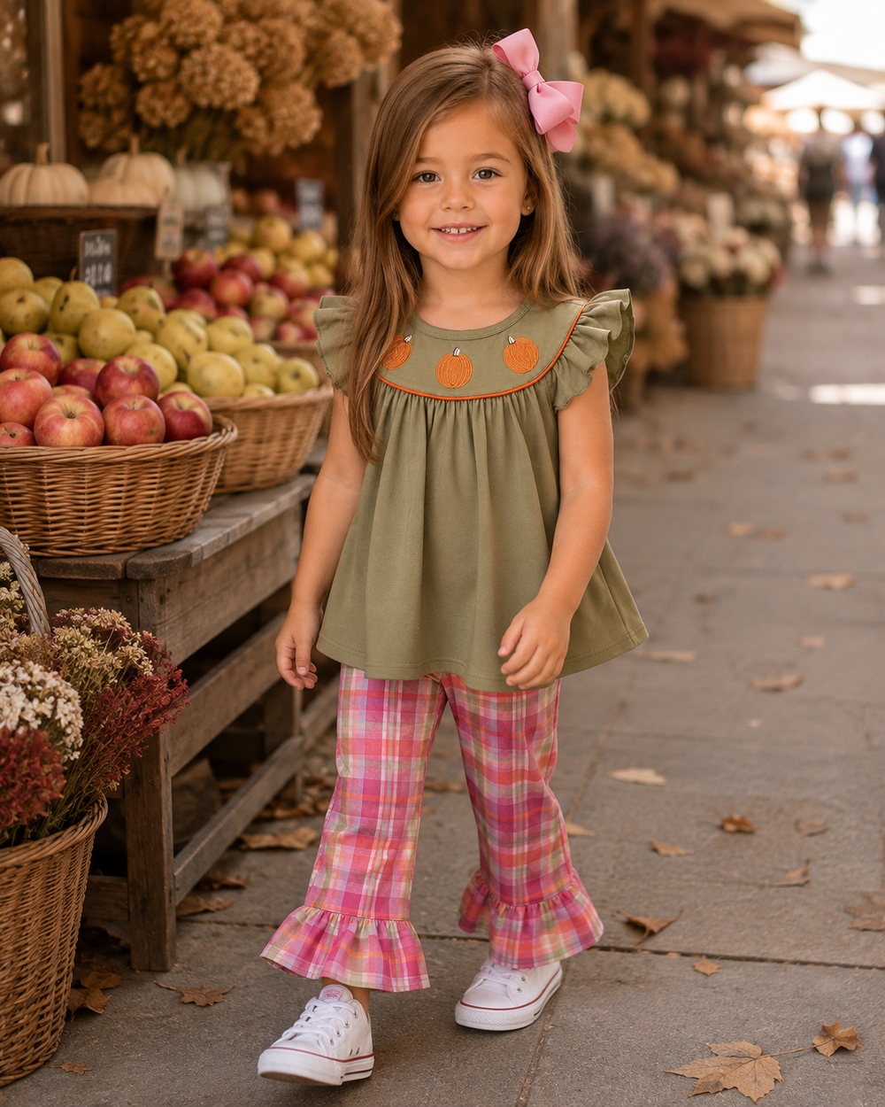 Olive pumpkin tunic and pink plaid ruffle pants on child