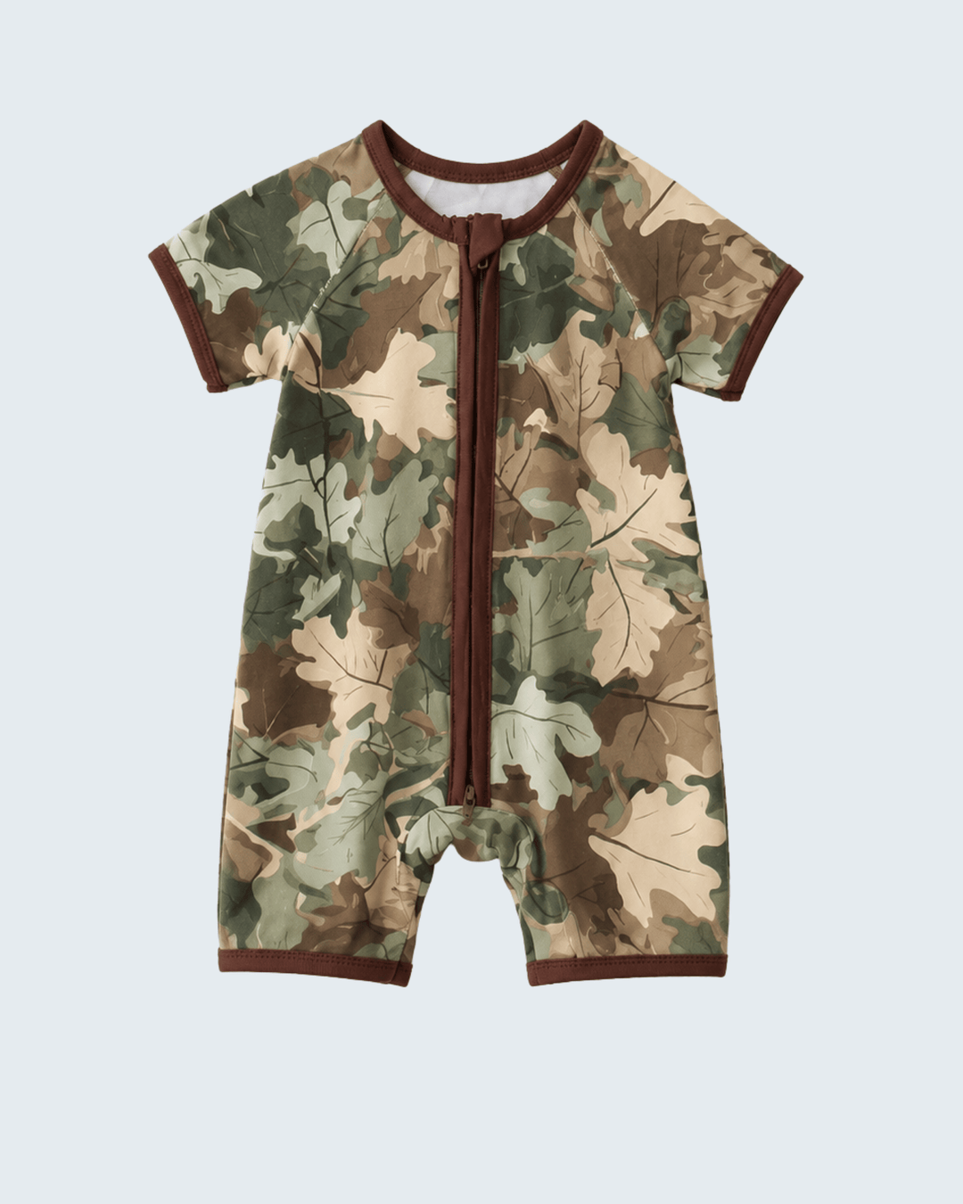 Camouflage-patterned baby romper with brown trim on a light gray background