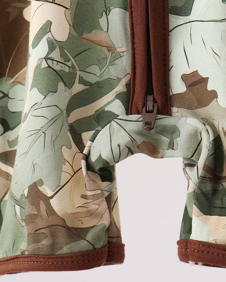 Camouflage-patterned romper with a brown zipper on a white background