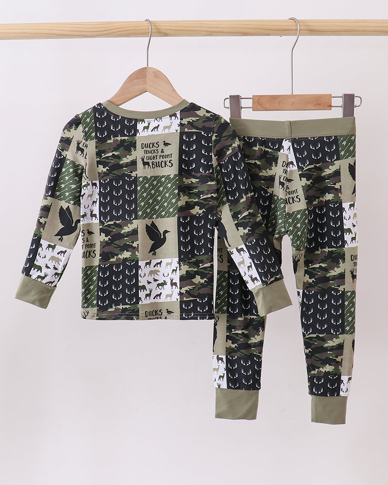Kids two-piece camo pajama set with deer, antler, and arrow prints on top and pants