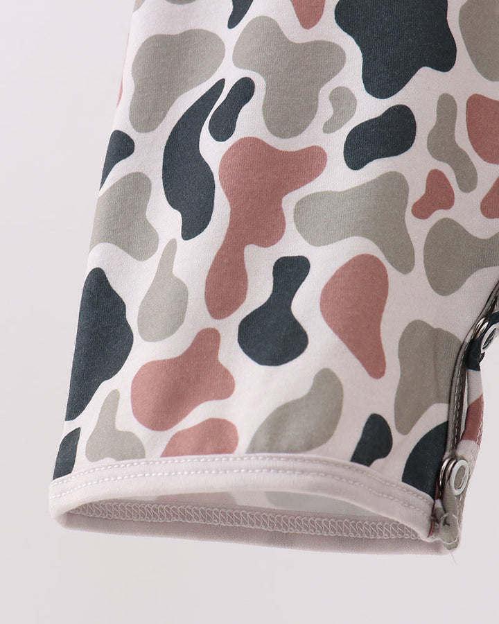 Camouflage-patterned romper with a snap buttons on a white background
