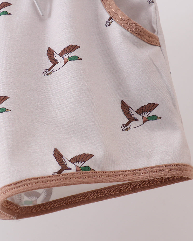 Close-up of an outfit with duck pattern on a light background