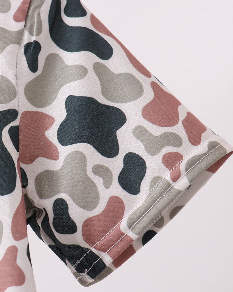 Camouflage-patterned fabric on a white background