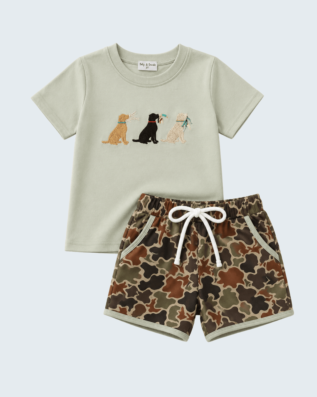 Children's t-shirt and shorts set with dog illustrations on a light green background