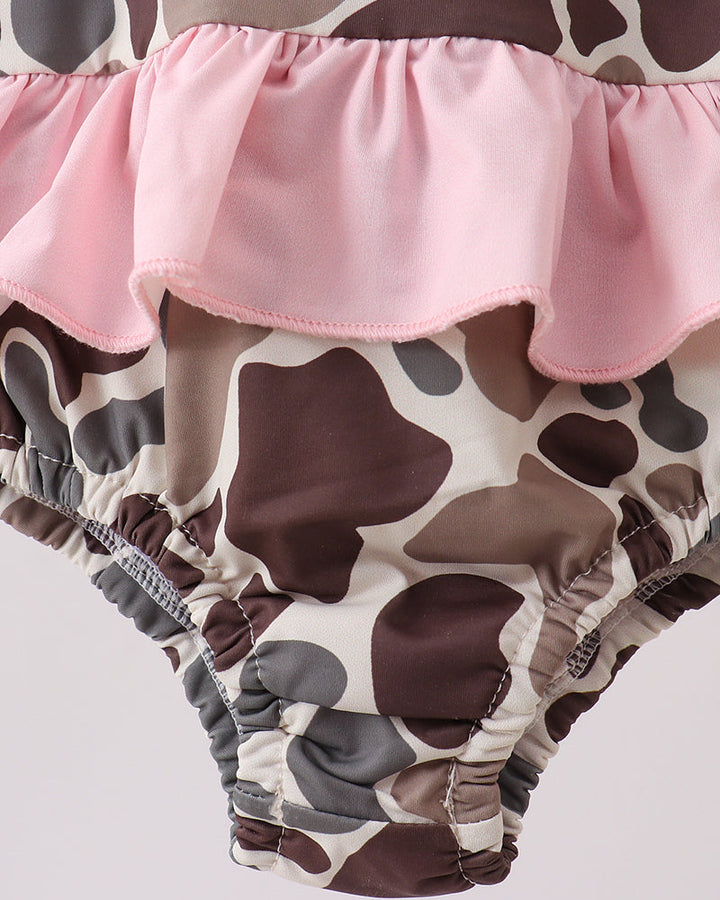Swimsuit with pink ruffle on a white background