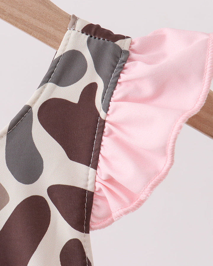 Swimsuit with camo print and pink trim on a white background