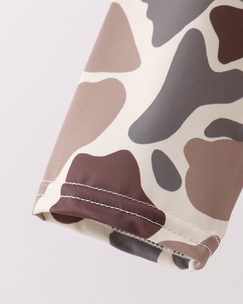 Camouflage-patterned fabric on a white background