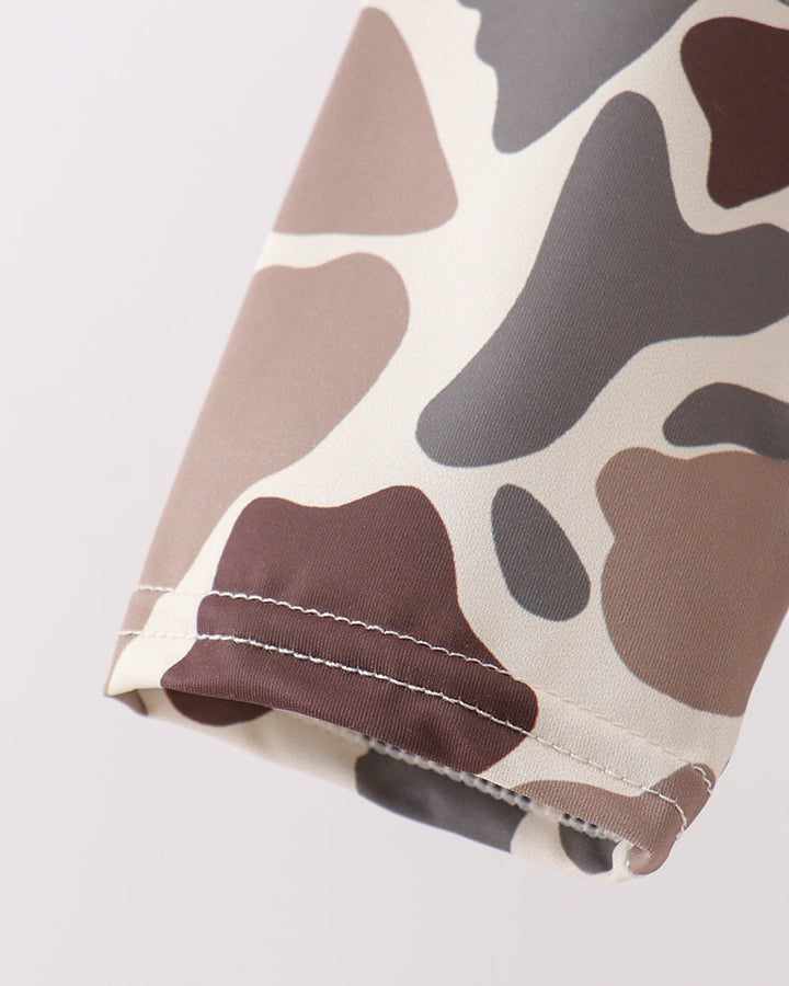 Camouflage-patterned fabric on a white background